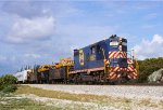 Florida East Coast, FEC GP9 662, is northbound with white flags flying on a work extra, at Deerfield Beach, Florida.  June 13, 1980. 